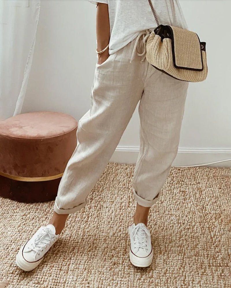 Breathable high-waist pants featuring a flowing silhouette and smooth finish, crafted from lightweight fabric for ultimate comfort and versatility. 0